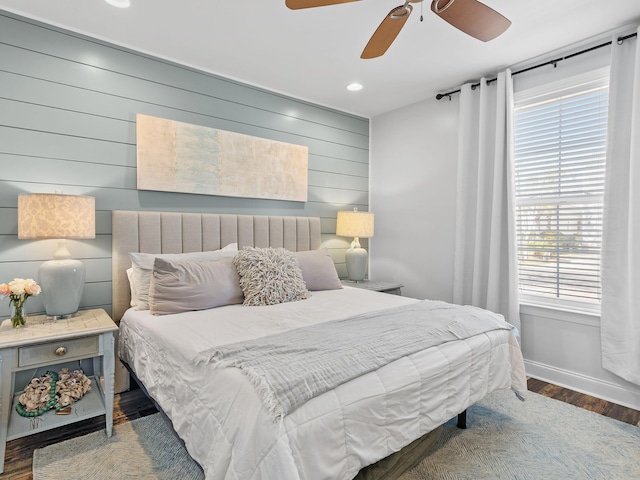 bedroom with a ceiling fan, recessed lighting, baseboards, and wood finished floors