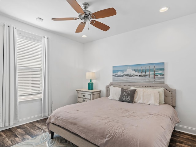 bedroom featuring dark wood-style flooring, recessed lighting, and baseboards