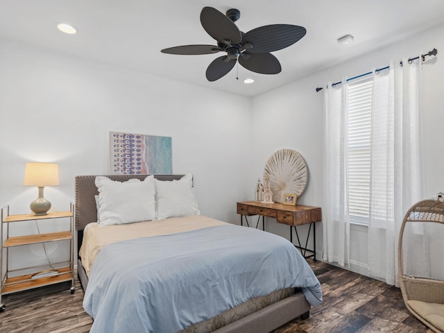 bedroom with recessed lighting, dark wood-style flooring, and multiple windows