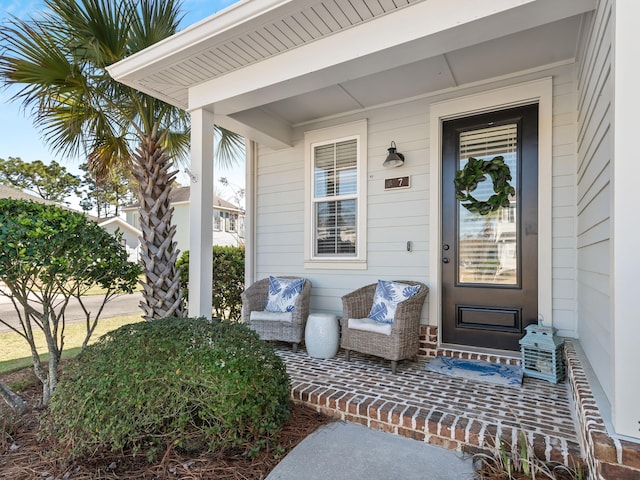 doorway to property featuring a porch