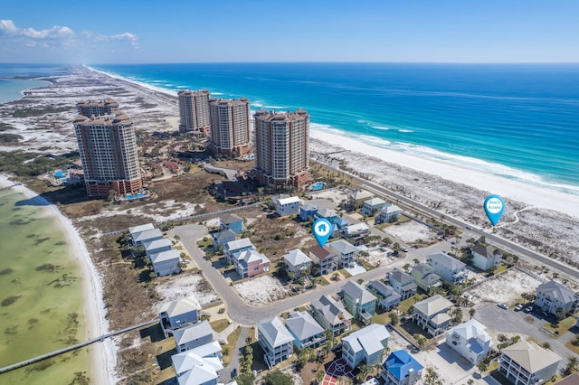 bird's eye view featuring a water view and a view of the beach