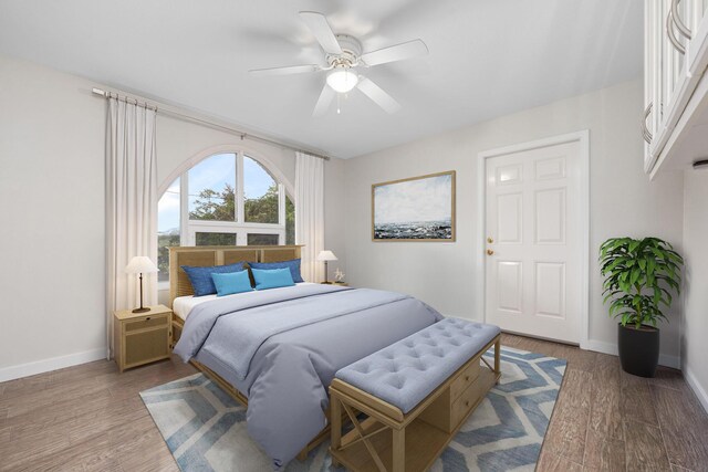 117 Hibiscus Ave, Gulf Breeze, FL 32561 - bedroom featuring ceiling fan, wood finished floors, and baseboards