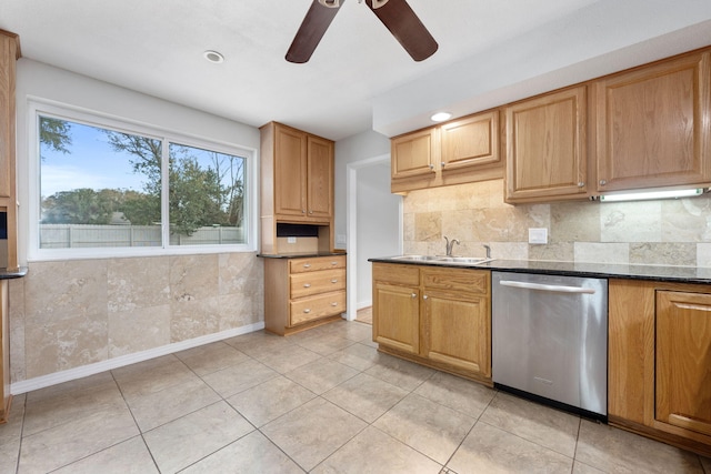 117 Hibiscus Ave, Gulf Breeze, FL 32561 - kitchen featuring light tile patterned floors, tasteful backsplash, a sink, dark stone counters, and dishwasher