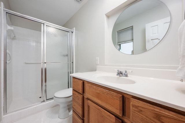 117 Hibiscus Ave, Gulf Breeze, FL 32561 - bathroom with toilet, tile patterned floors, a shower stall, and vanity