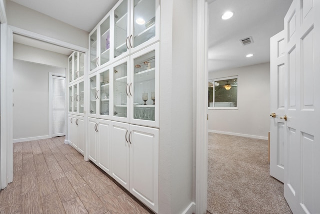 117 Hibiscus Ave, Gulf Breeze, FL 32561 - hallway with light wood finished floors, baseboards, visible vents, and recessed lighting