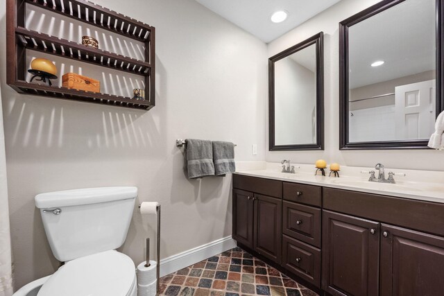 117 Hibiscus Ave, Gulf Breeze, FL 32561 - full bath featuring toilet, recessed lighting, a sink, baseboards, and double vanity