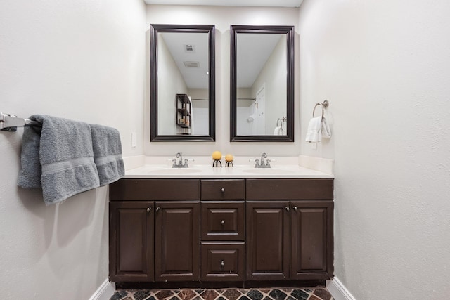 117 Hibiscus Ave, Gulf Breeze, FL 32561 - full bath featuring double vanity, a sink, visible vents, and baseboards