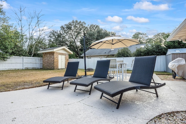 117 Hibiscus Ave, Gulf Breeze, FL 32561 - view of patio featuring an outbuilding, a fenced backyard, a storage shed, and area for grilling