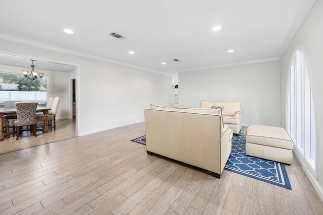 117 Hibiscus Ave, Gulf Breeze, FL 32561 - living area with light wood finished floors, baseboards, visible vents, and ornamental molding