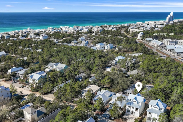 drone / aerial view featuring a water view and a residential view