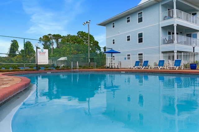 community pool featuring fence