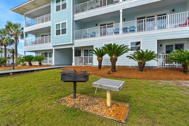 view of home's community with a lawn