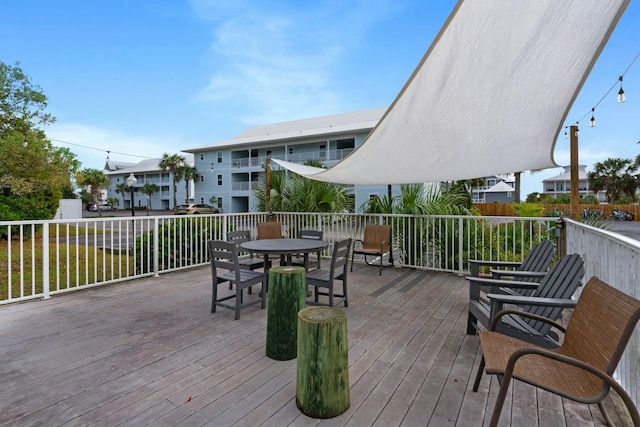 wooden deck featuring outdoor dining space