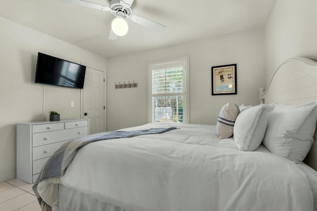 bedroom featuring ceiling fan and light tile patterned floors