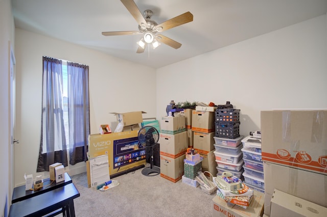 interior space with ceiling fan