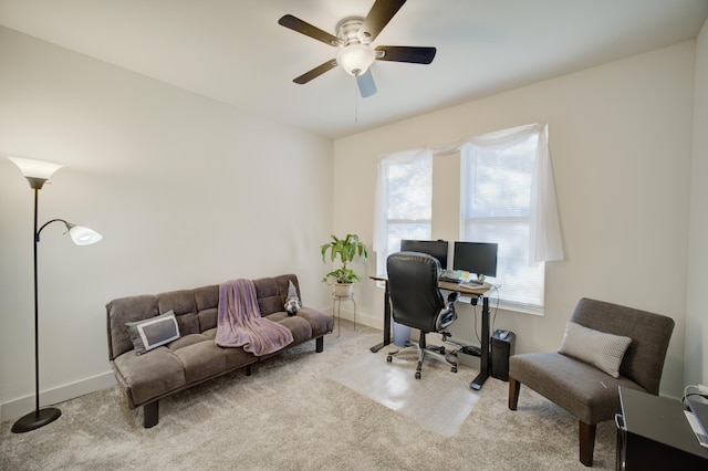 office with carpet floors, baseboards, and a ceiling fan