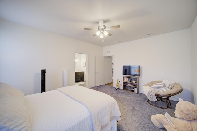 bedroom with a ceiling fan, visible vents, connected bathroom, and carpet flooring