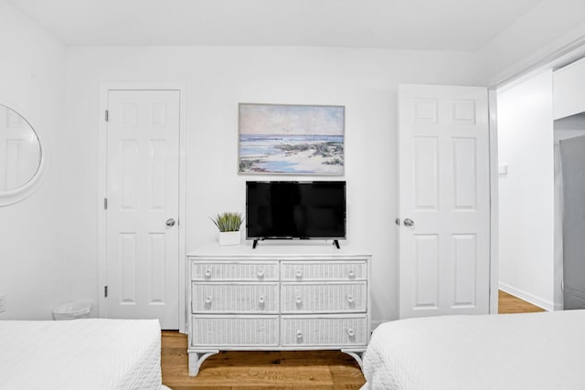 bedroom with hardwood / wood-style flooring