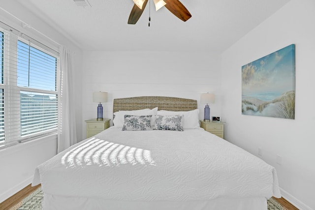 bedroom featuring light hardwood / wood-style flooring and ceiling fan
