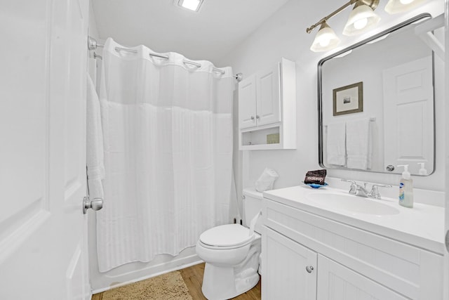 full bathroom with shower / bath combo with shower curtain, vanity, toilet, and wood-type flooring