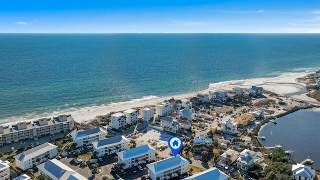 birds eye view of property featuring a water view and a view of the beach