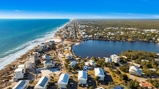 bird's eye view with a water view and a view of the beach