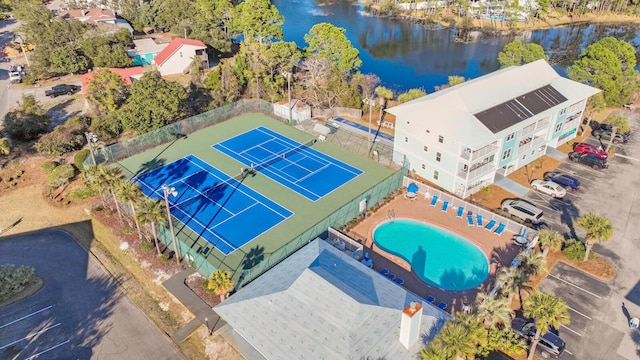 birds eye view of property with a water view