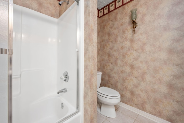 full bath with combined bath / shower with glass door, toilet, and tile patterned floors