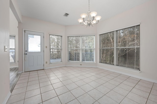 interior space with visible vents and a notable chandelier