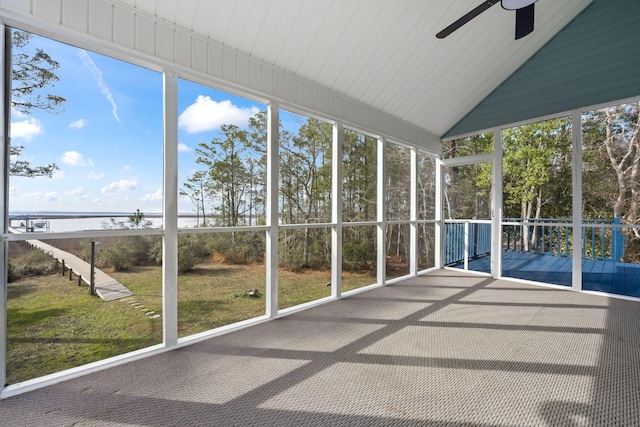 unfurnished sunroom featuring lofted ceiling and ceiling fan