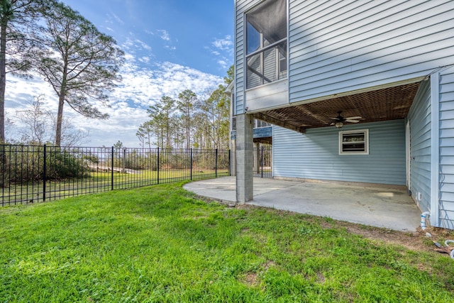 view of yard featuring ceiling fan, a patio area, and a fenced backyard