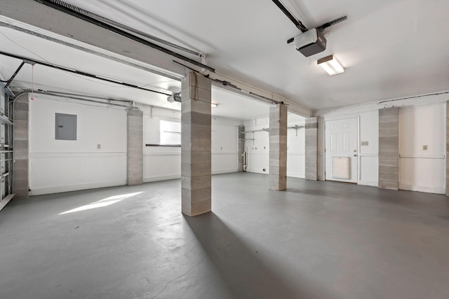 parking deck featuring a garage door opener and electric panel