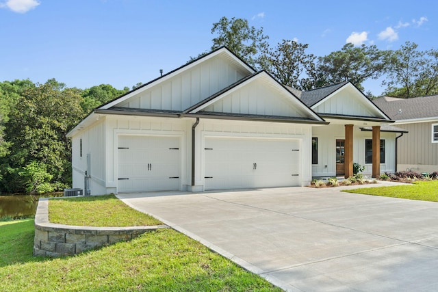 1720 25th St, Niceville, FL 32578 - modern farmhouse with board and batten siding, an attached garage, concrete driveway, and a front yard