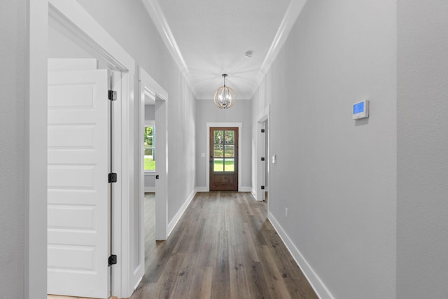 1720 25th St, Niceville, FL 32578 - entryway featuring crown molding, dark wood-type flooring, a chandelier, and baseboards