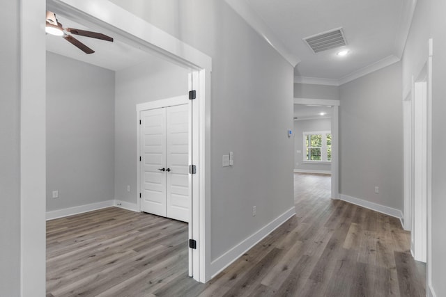 1720 25th St, Niceville, FL 32578 - corridor featuring wood finished floors, ornamental molding, baseboards, and recessed lighting