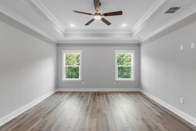 1720 25th St, Niceville, FL 32578 - spare room with a raised ceiling, hardwood / wood-style flooring, crown molding, a ceiling fan, and baseboards