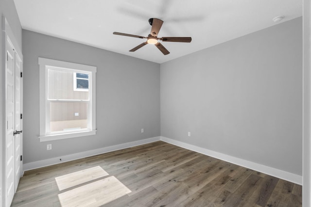 1720 25th St, Niceville, FL 32578 - unfurnished room with a ceiling fan, wood finished floors, and baseboards