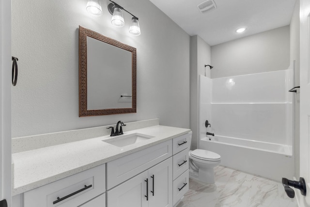 1720 25th St, Niceville, FL 32578 - bathroom featuring vanity, marble look tiles, toilet, and bathtub / shower combination