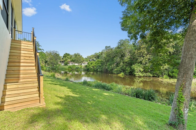 1720 25th St, Niceville, FL 32578 - view of green lawn featuring a water view and stairs