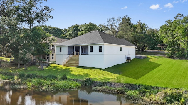 1720 25th St, Niceville, FL 32578 - back of property featuring stairway, a yard, and a water view