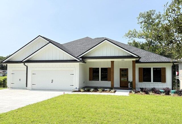 1720 25th St, Niceville, FL 32578 - modern farmhouse style home featuring roof with shingles, a garage, a front lawn, and board and batten siding