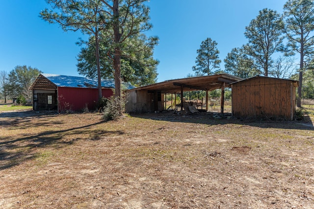 view of yard with an outbuilding and a pole building