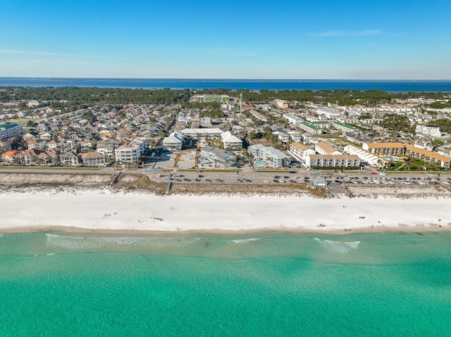 drone / aerial view with a water view, a residential view, and a beach view