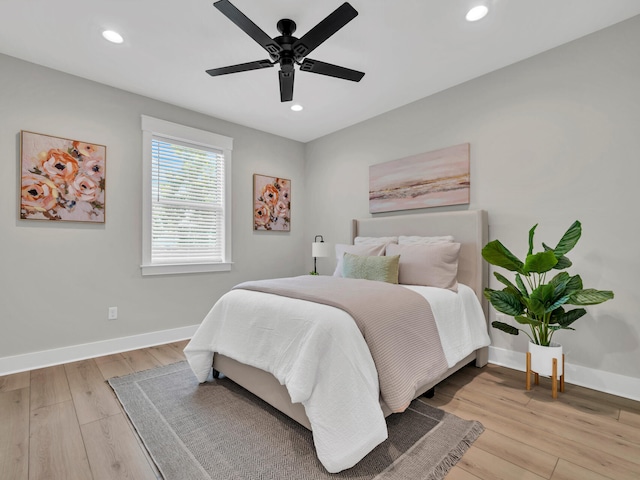 bedroom with ceiling fan and light hardwood / wood-style flooring