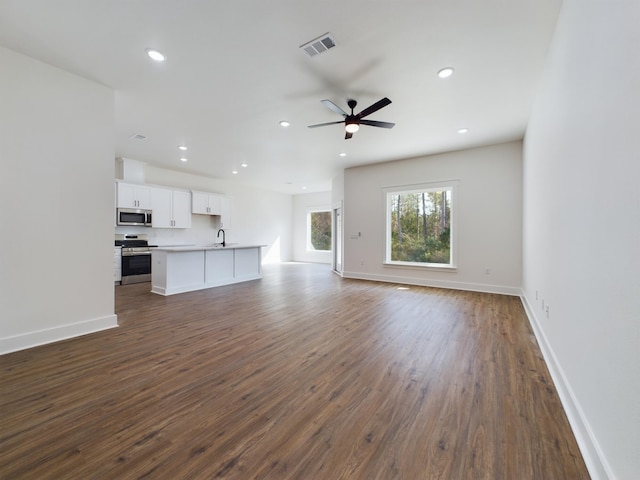 325 Shoal River Dr, Crestview, FL 32539 - unfurnished living room featuring ceiling fan, sink, and dark hardwood / wood-style floors