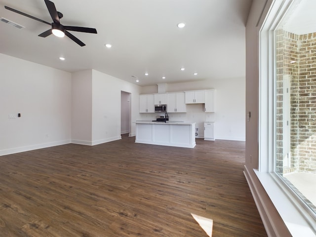 325 Shoal River Dr, Crestview, FL 32539 - unfurnished living room featuring ceiling fan and dark hardwood / wood-style floors