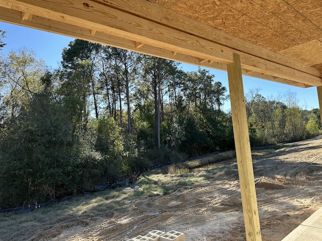 view of patio featuring a view of trees