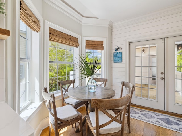 24 High Tide Way, Inlet Beach, FL 32461 - dining space featuring ornamental molding, plenty of natural light, wood finished floors, french doors, and wooden walls