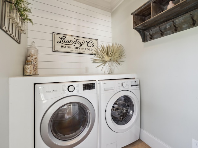 24 High Tide Way, Inlet Beach, FL 32461 - laundry area with independent washer and dryer, crown molding, wooden walls, and baseboards