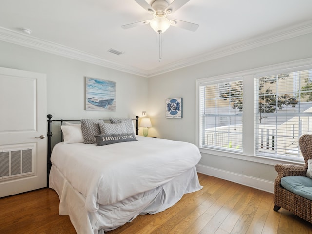 24 High Tide Way, Inlet Beach, FL 32461 - bedroom featuring ornamental molding, light wood-style flooring, multiple windows, baseboards, and a ceiling fan